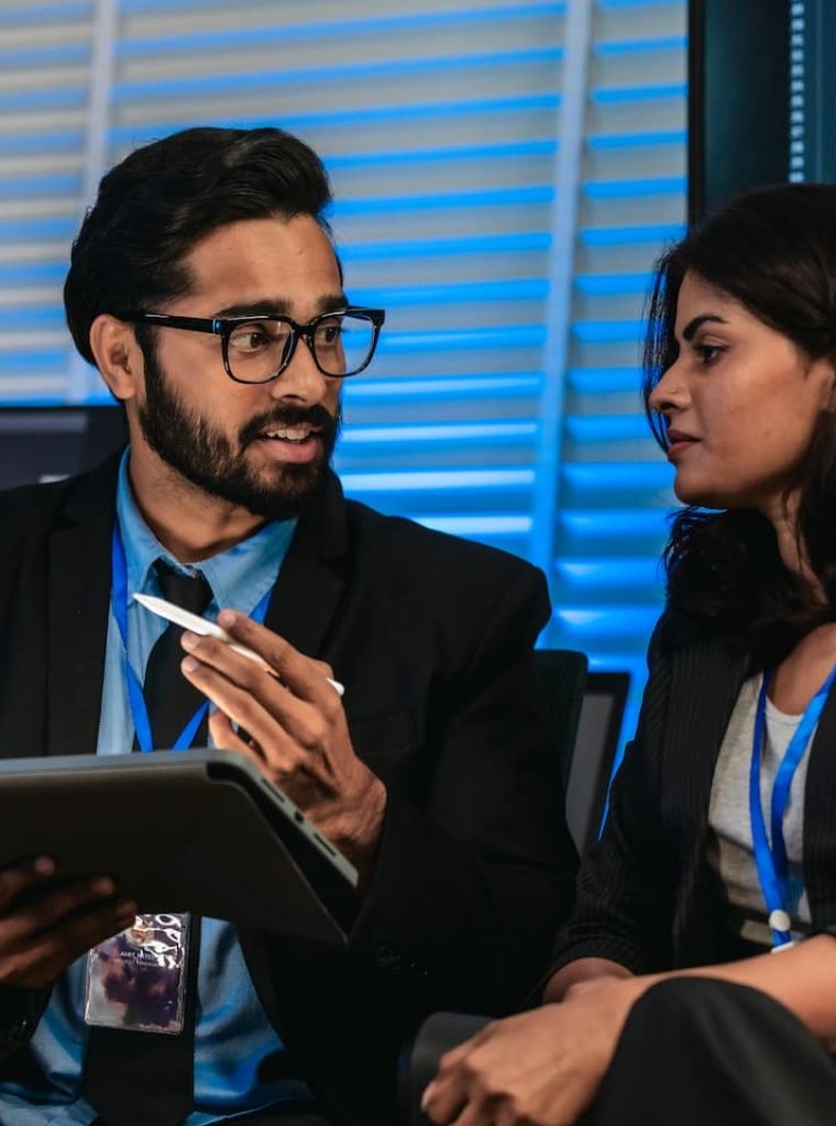 software-developers-discussing-code-NMYFPAP