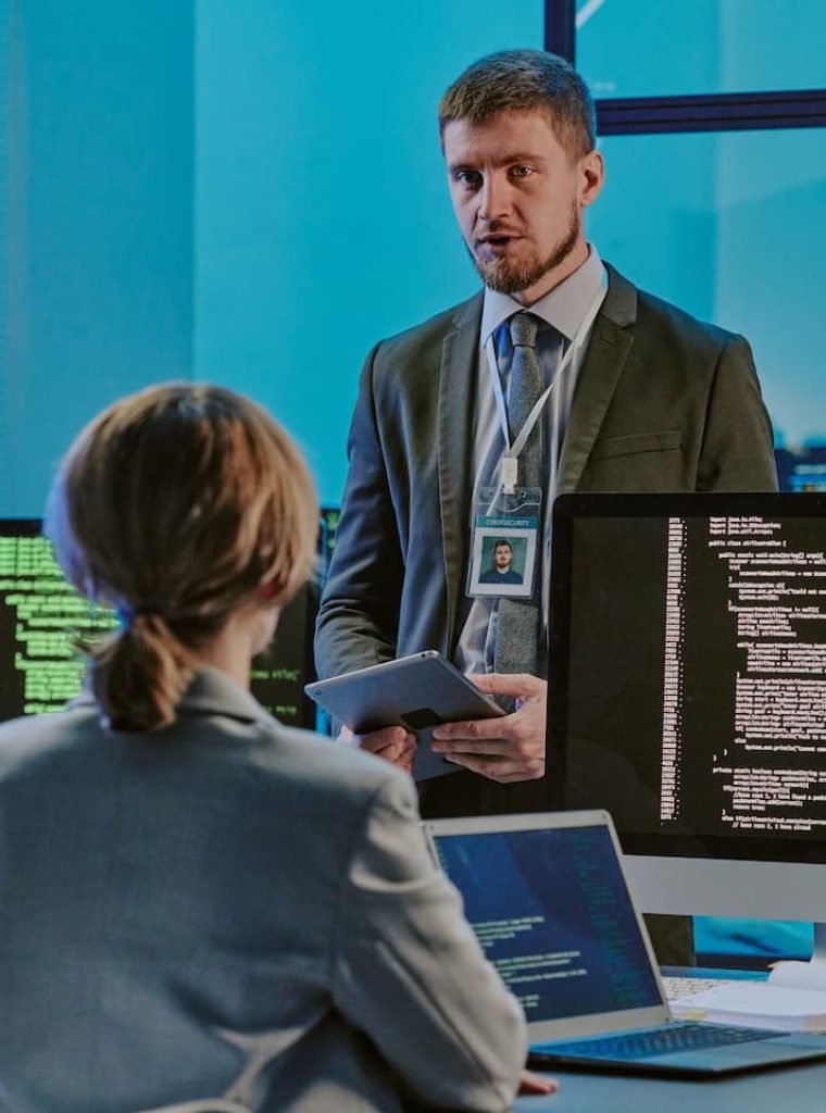 three-young-people-having-meeting-in-cybersecurity-6ZKCMRG